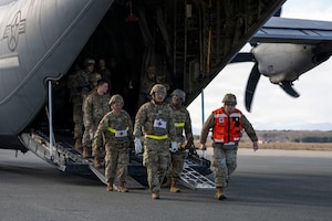 U.S. Airmen assigned to the 35th Medical Group carry a casualty actor out of a C-130J Super Hercules assigned to the 374th Airlift Wing during Freedom Lift in support of Exercise Freedom Shield at Misawa Air Base, Japan, March 10, 2026.