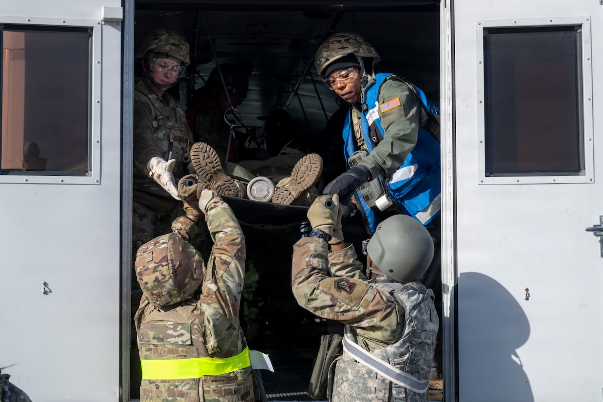 U.S. Airmen assigned to the 35th Medical Group load a casualty actor onto a medical transport during Freedom Lift in support of Exercise Freedom Shield at Misawa Air Base, Japan, March 10, 2026.