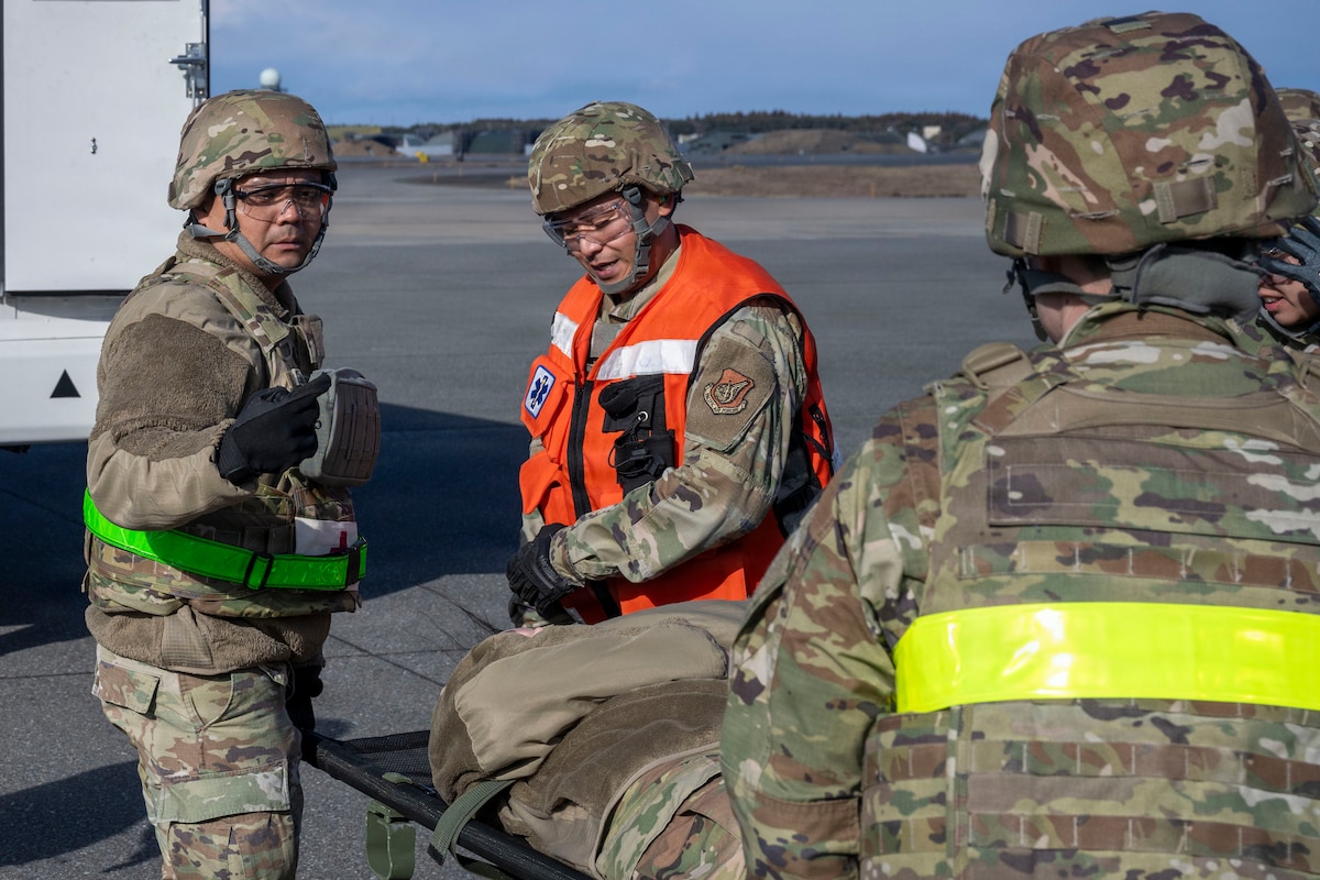 U.S. Airmen assigned to the 35th Medical Group carry a casualty actor to a medical transport during Freedom Lift in support of Exercise Freedom Shield at Misawa Air Base, Japan, March 10, 2026.