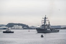 U.S. Navy Arleigh Burke-class guided-missile destroyer USS Mustin (DDG 89) arrives at Commander, Fleet Activities Yokosuka, Japan, March 23, 2026.