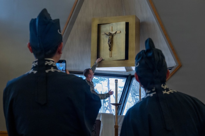Japanese Priests are shown a rotating-face system used for Catholic, Protestant, and neutral services in the Chapel at Misawa Air Base, Japan, Feb 26th, 2026.