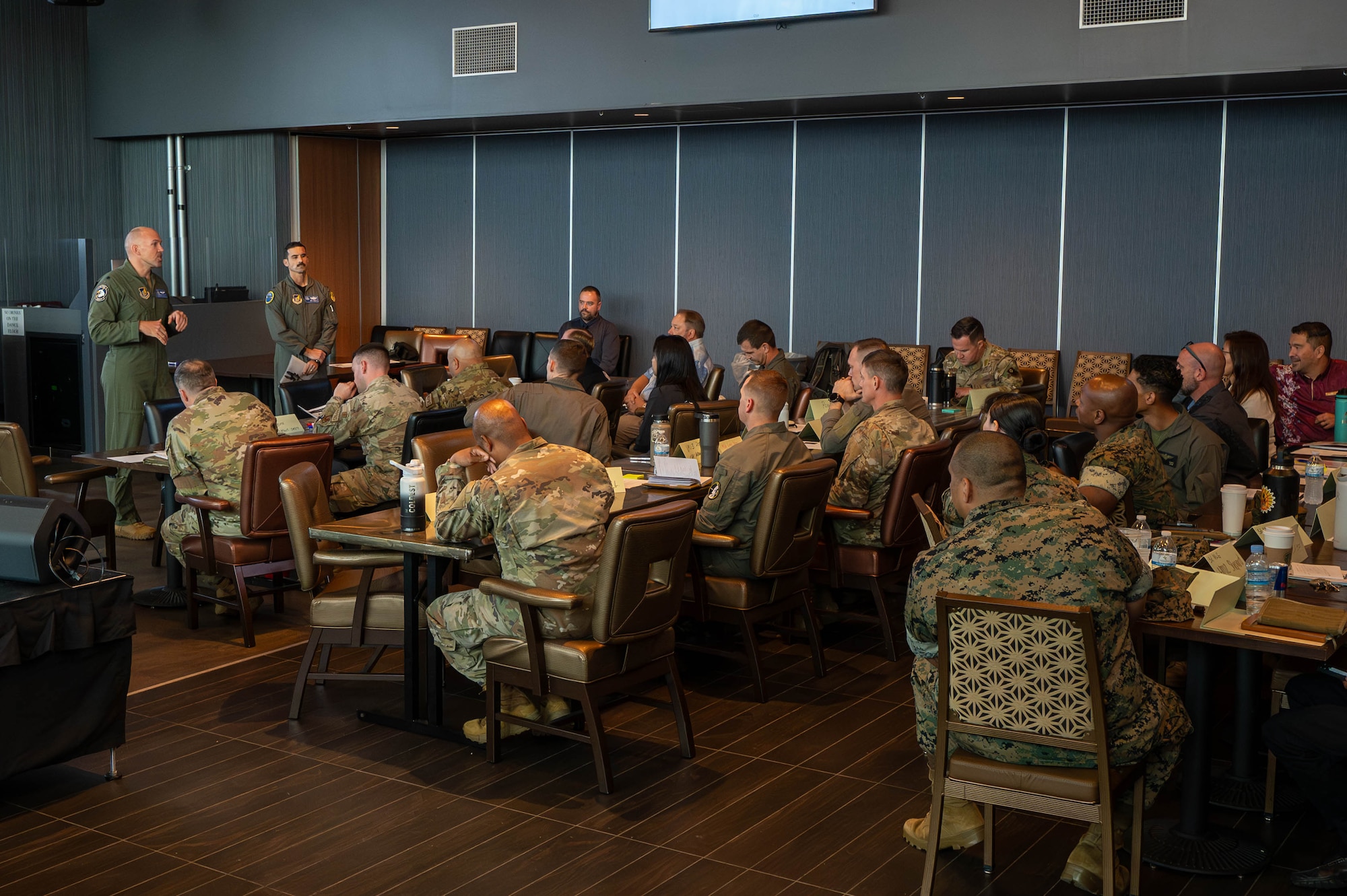 U.S. Air Force Lt. Col. Brandon Krupa, left, 18th Wing chief of safety, introduces U.S. Air Force Col. Robert Arnett, 18th Wing deputy commander, during the inaugural Joint Okinawa Safety Summit at Kadena Air Base, Japan, March 20, 2026. The summit brought together more than 40 safety professionals from 11 organizations across four services to address shared risks and strengthen joint operations. (U.S. Air Force photo by Airman 1st Class Nathaniel Jackson)