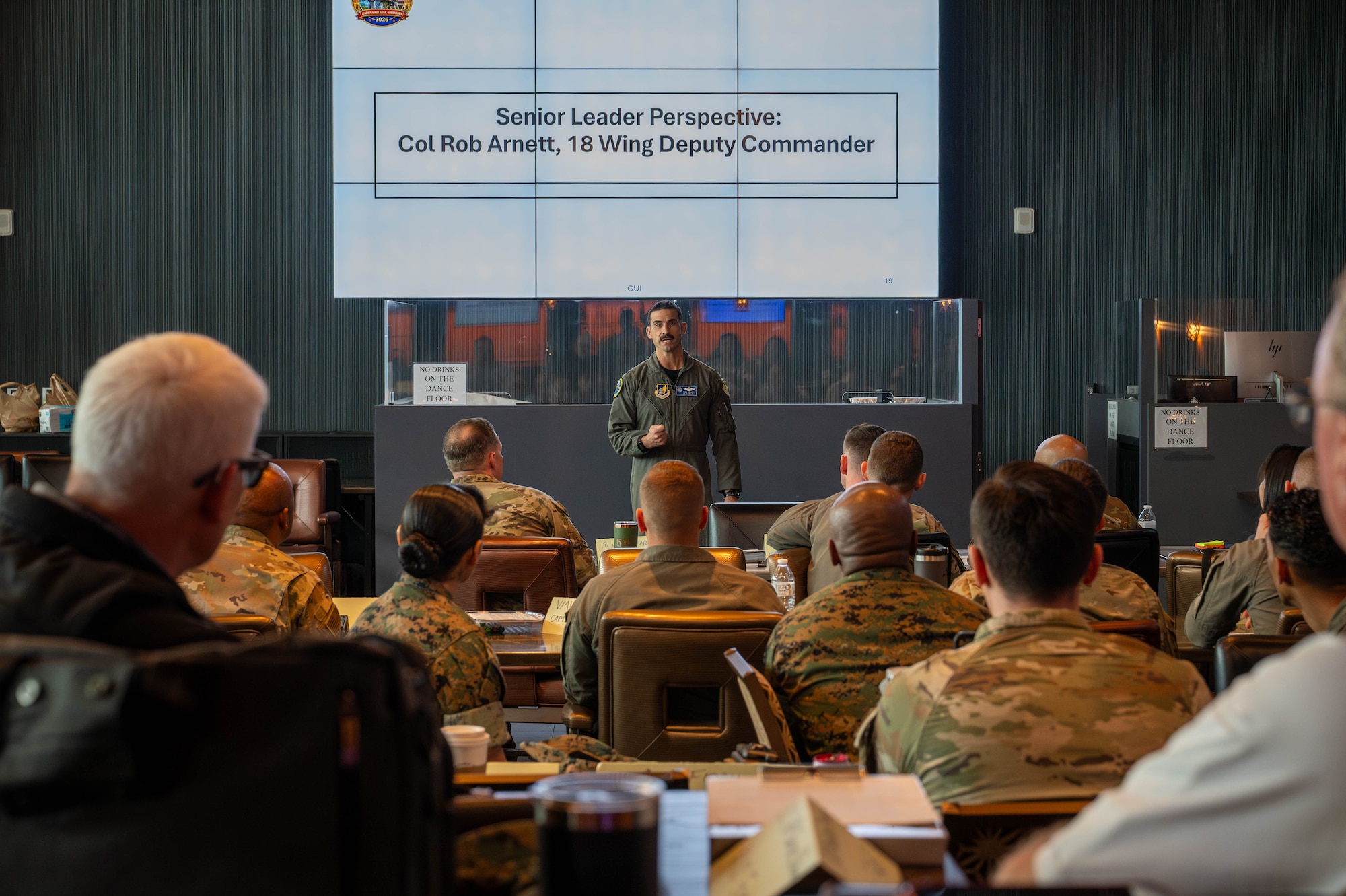 U.S. Air Force Col. Robert Arnett, 18th Wing deputy commander, shares his perspective with attendees during the inaugural Joint Okinawa Safety Summit at Kadena Air Base, Japan, March 20, 2026. The discussions focused on identifying common risks and developing joint solutions to improve safety and mission effectiveness across Okinawa. (U.S. Air Force photo by Airman 1st Class Nathaniel Jackson)