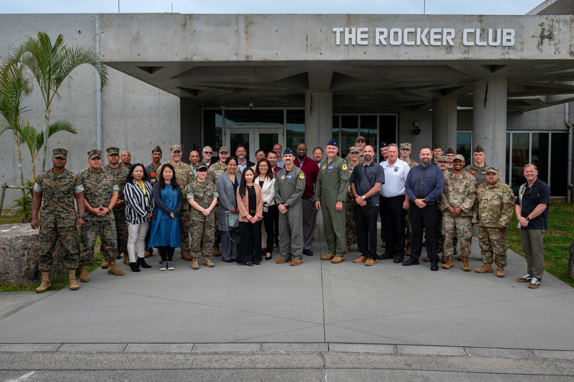 U.S. Air Force Col. Robert Arnett, middle, 18th Wing deputy commander, and U.S. Air Force Lt. Col. Brandon Krupa, middle right, 18th Wing chief of safety, pose with attendees following the inaugural Joint Okinawa Safety Summit at Kadena Air Base, Japan, March 20, 2026. The event reinforced collaboration among safety professionals across Okinawa. (U.S. Air Force photo by Airman 1st Class Nathaniel Jackson)