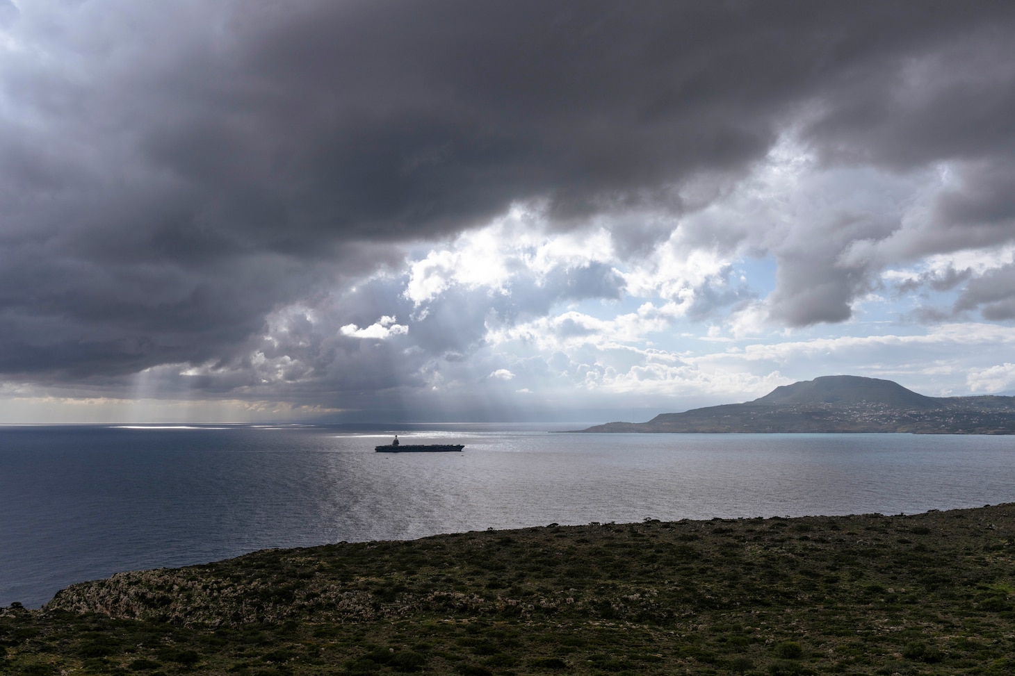 The world’s largest aircraft carrier, Ford-class aircraft carrier USS Gerald R. Ford (CVN 78), arrives at the NATO Marathi Pier Complex in Souda Bay, Crete, Greece, during a scheduled port visit on March 23, 2026.