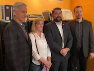 Naval Criminal Investigative Service Director Omar Lopez and his wife pose for a photo with Mark Harmon and Sean Murray on the set of CBS' NCIS television series.
