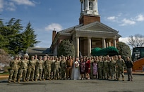 Indiana National Guard members pose for a photo after a wedding ceremony at the Old Post Chapel on Fort Myer, Virginia, March 21, 2026. About 2,700 National Guard members support the D.C. Safe and Beautiful mission, assisting the Metropolitan Police Department in maintaining public safety for residents, commuters and visitors throughout the District.