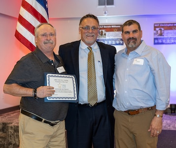 Donald Siltman, left, is presented the Command Sgt. Maj. Michael A. Nuding award during the Gold Star Mission scholarship banquet in Springfield March 21.