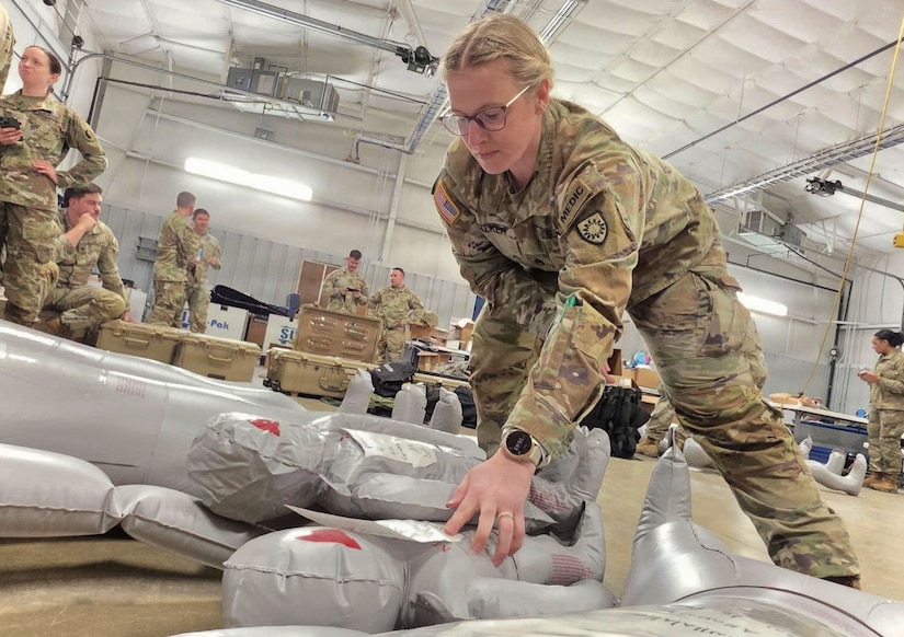 U.S. Army Staff Sgt. Lauren Walker from the 940th MP Unit triages medical dummies during the 68W combat medic recertification course at Wendel H. Ford Regional Training Center in Greenville, Kentucky, March 2, 2026.