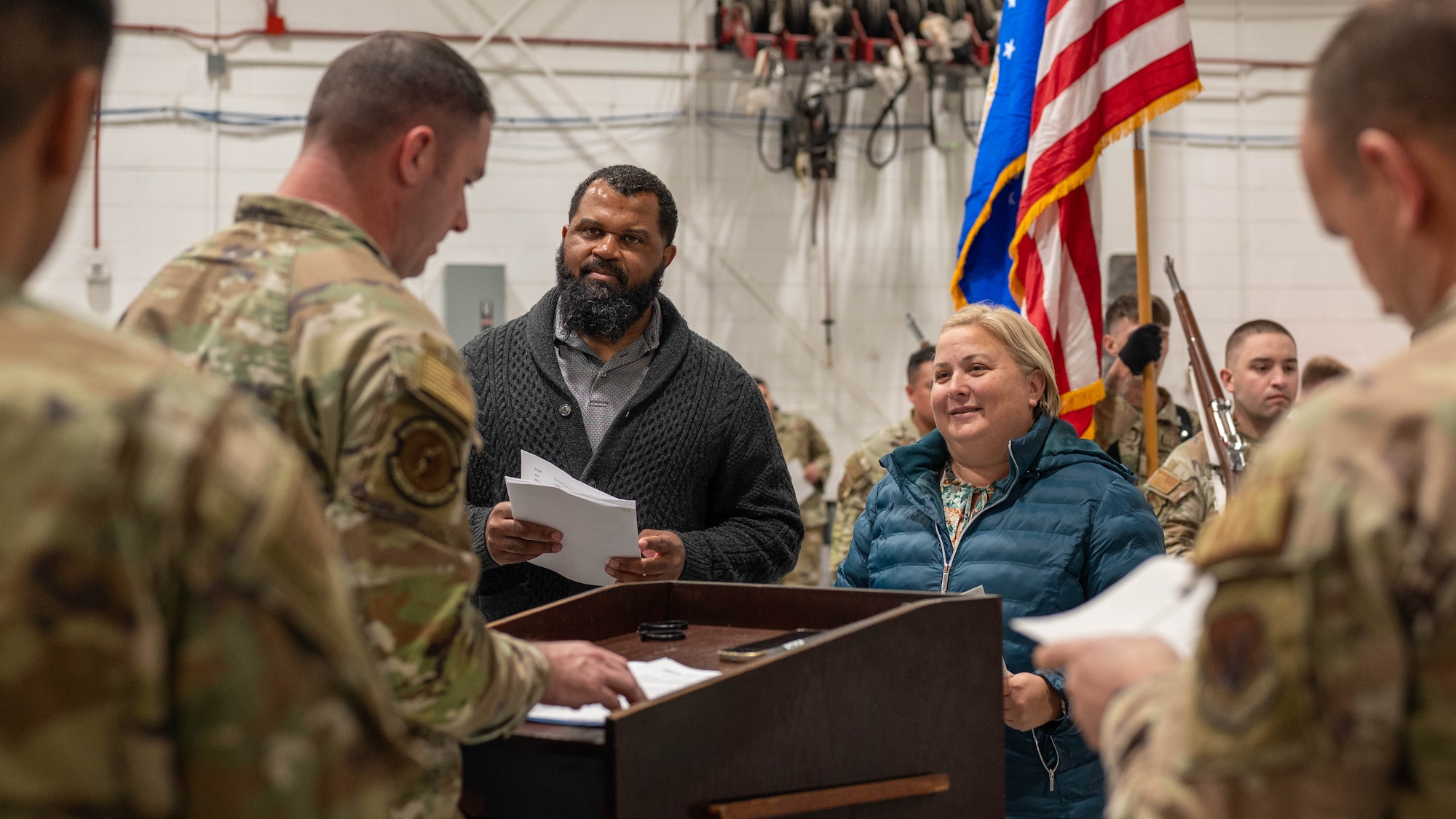 Christi Skiles, 325th Fighter Wing chief of protocol, and Marshall Dixon, 325th FW protocol specialist, review an itinerary during a ceremony rehearsal at Tyndall Air Force Base, Florida, Feb.5, 2026.