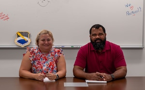 Christi Skiles, 325th Fighter Wing chief of protocol, and Marshall Dixon, 325th FW protocol specialist, pose for a photo at Tyndall Air Force Base, Florida, Feb.  27, 2026.