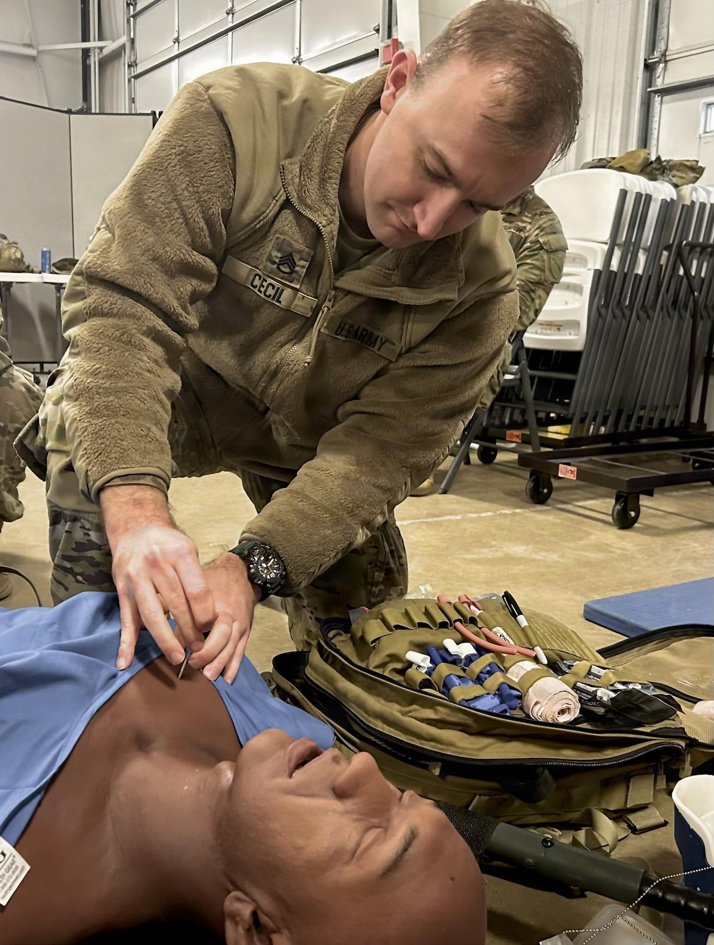 U.S. Army Staff Sgt. Colin Cecil, with the 138th Operations Fires Command, uses a needle chest compression during 68W combat medic recertification course held at Wendell H. Ford Regional Training Center March 2, 2026.