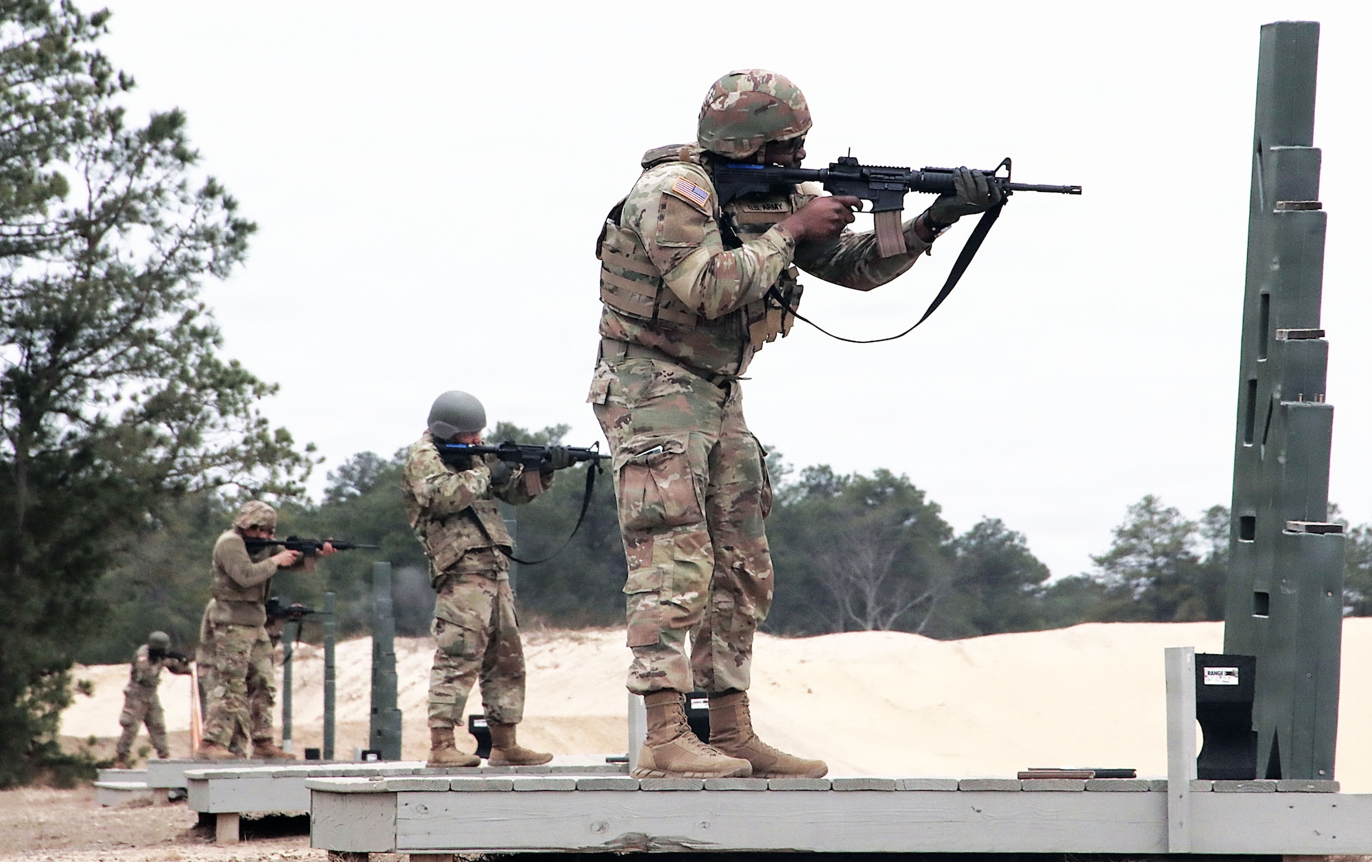 U.S. Army Reserve Soldiers assigned to the 77th Sustainment Brigade engage targets during weapons qualification on a live-fire range during Exercise Liberty Victory at Joint Base McGuire-Dix-Lakehurst, N.J., March 14, 2026. The field training exercise, involving more than 1,000 Soldiers, focused on building combat readiness, reinforcing warfighter skills and preparing personnel for real-world deployments. (U.S. Army photo by Steven Roussel)