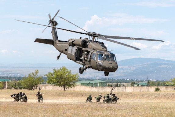 A Georgia Army National Guard UH-60 Black Hawk from the Marietta based, 1st Battalion, 171st Aviation Regiment, lifts off rapidly after inserting Georgian special forces during an urban operations exercise at the Vaziani Training Area on Aug 5, 2018 during Noble Partner 18. The exercise highlights the 24 years the two militaries have worked together under the U.S. National Guard’s State Partnership Program.

 

U.S Army photo by Staff Sgt. R. J. Lannom Jr