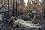 U.S. Air Force Airmen assigned to the 125th Security Forces Squadron, Florida Air National Guard, and 824th Base Defense Squadron participate in a field training exercise at Moody Air Force Base, Georgia, Feb. 6, 2026. The field training exercise validated two weeks of small unit tactics, Tactical Combat Casualty Care and mission planning instruction. Photo by Senior Airman Savannah Carpenter.