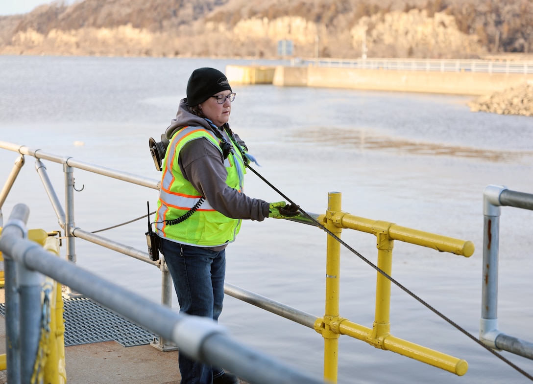 Woman locks a tow boat