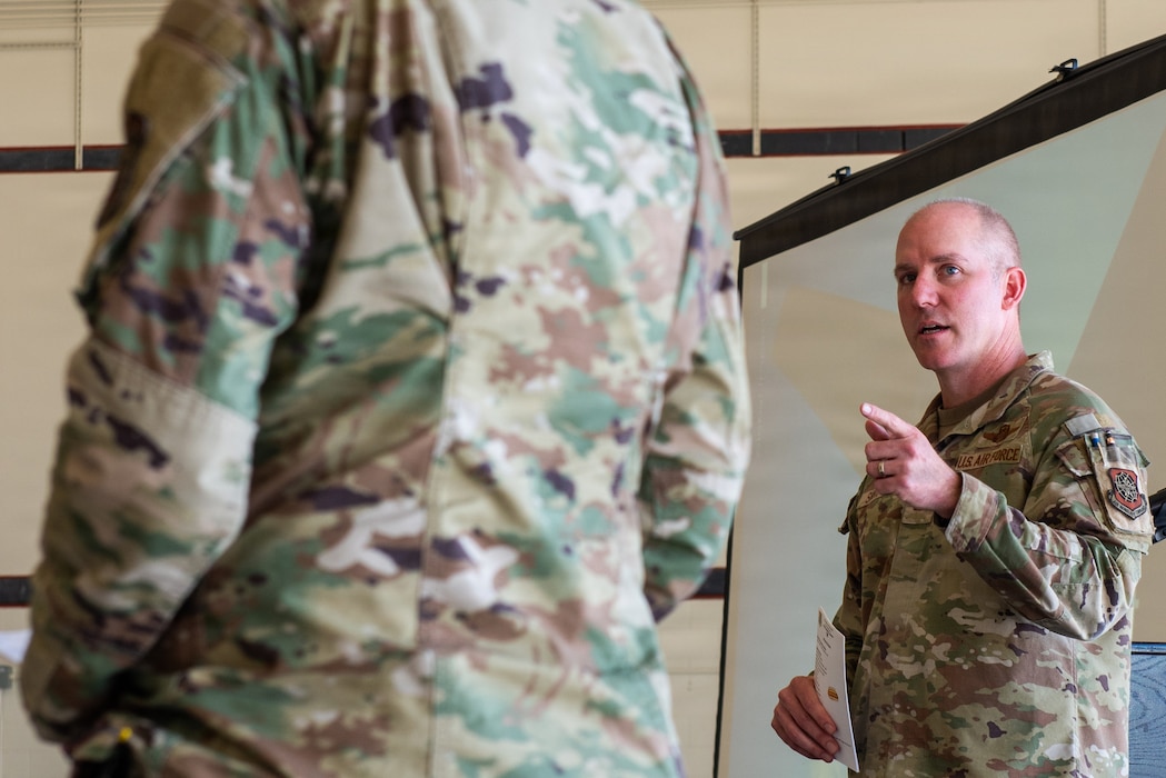 Wing commander delivering remarks