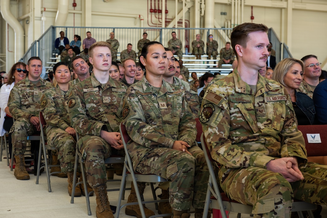 Airmen sitting in audience who will be highlighted during ceremony
