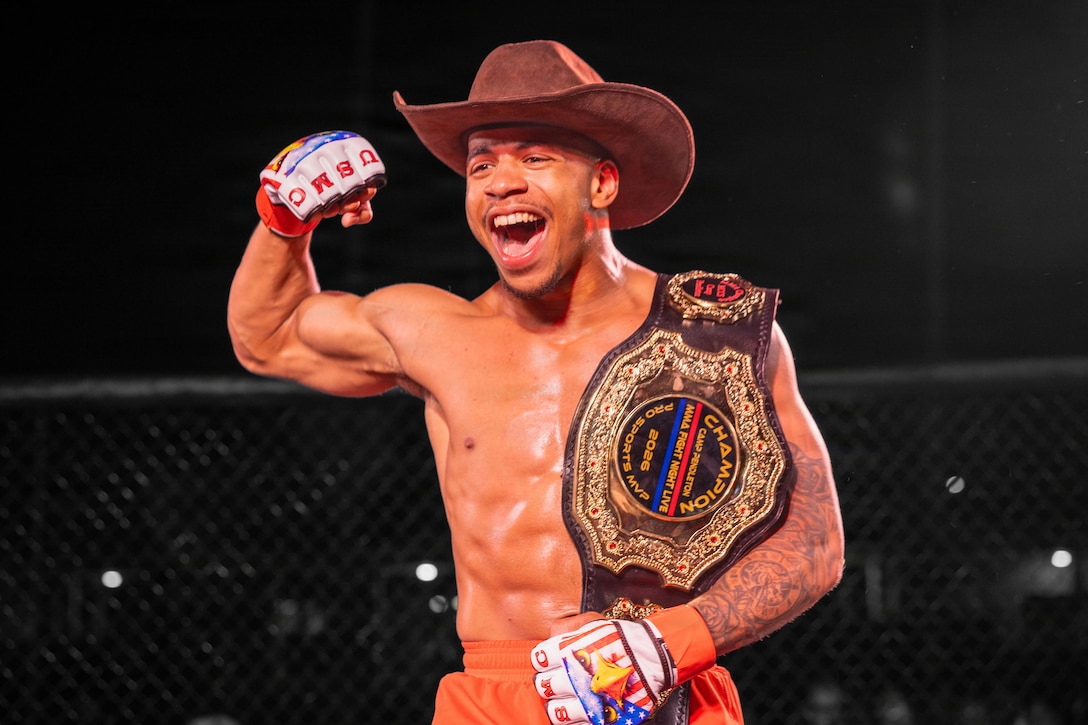Ryan Pean, an amateur mixed martial arts fighter out of Puerto Rico, celebrates championship win during the MMA Fight Night at Marine Corps Base Camp Pendleton, Calif., March 20, 2026. The event was coordinated by Marine Corps Community Services to promote base cohesion, increase morale and provide entertainment. (U.S. Marine Corps illustration by Lance Cpl. Estada)