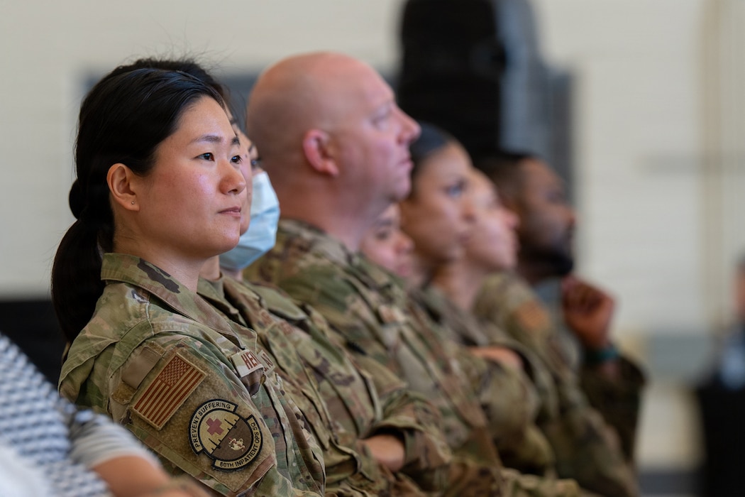 One of the highlighted Airmen viewing the ceremony from the audience during a ceremony