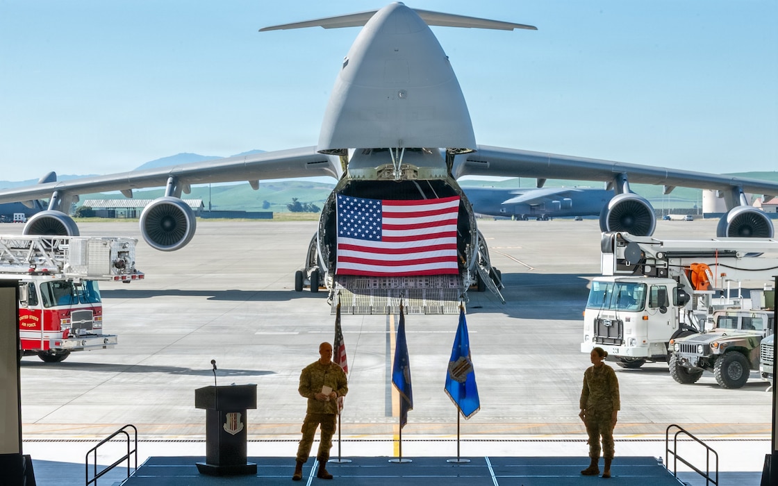 Wing leadership deliver remarks during a ceremony