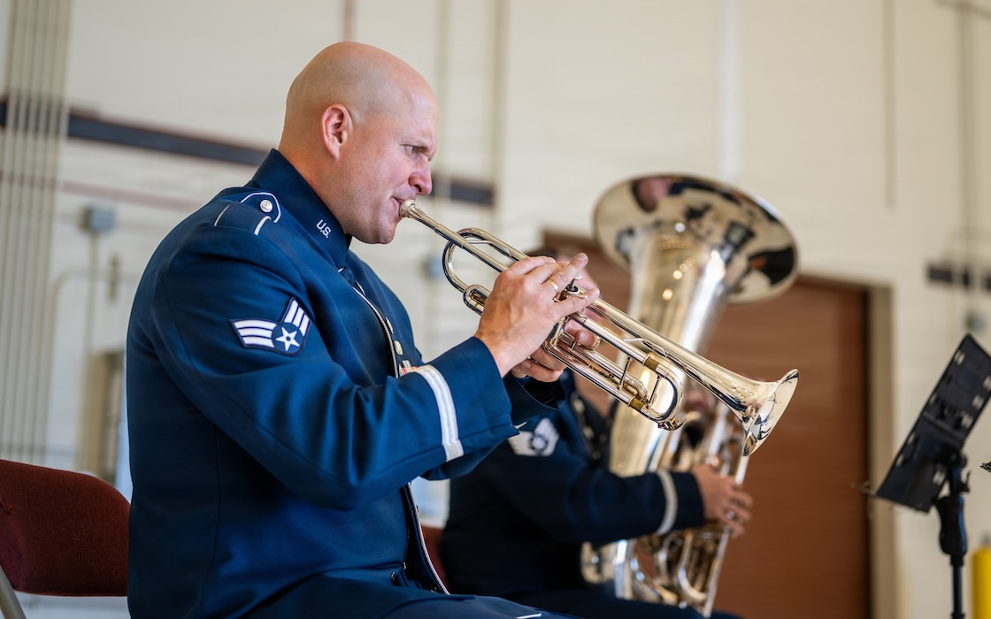 A band member plays his instrument during a ceremony