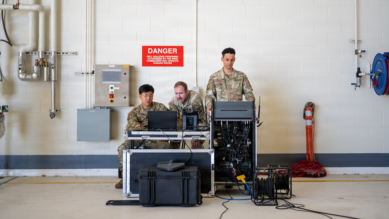 Airmen troubleshoot audio equipment
