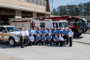 Members of the Arnold Air Force Base Fire and Emergency Services team assemble to recreate a photograph first taken in 1954, echoing the early days of the installation. The image serves as a tribute as Arnold AFB prepares to mark its 75th anniversary this June and honors the firefighters, engineers and Airmen whose work has shaped the base’s mission across generations. (U.S. Air Force photo by Keith Thornburgh)