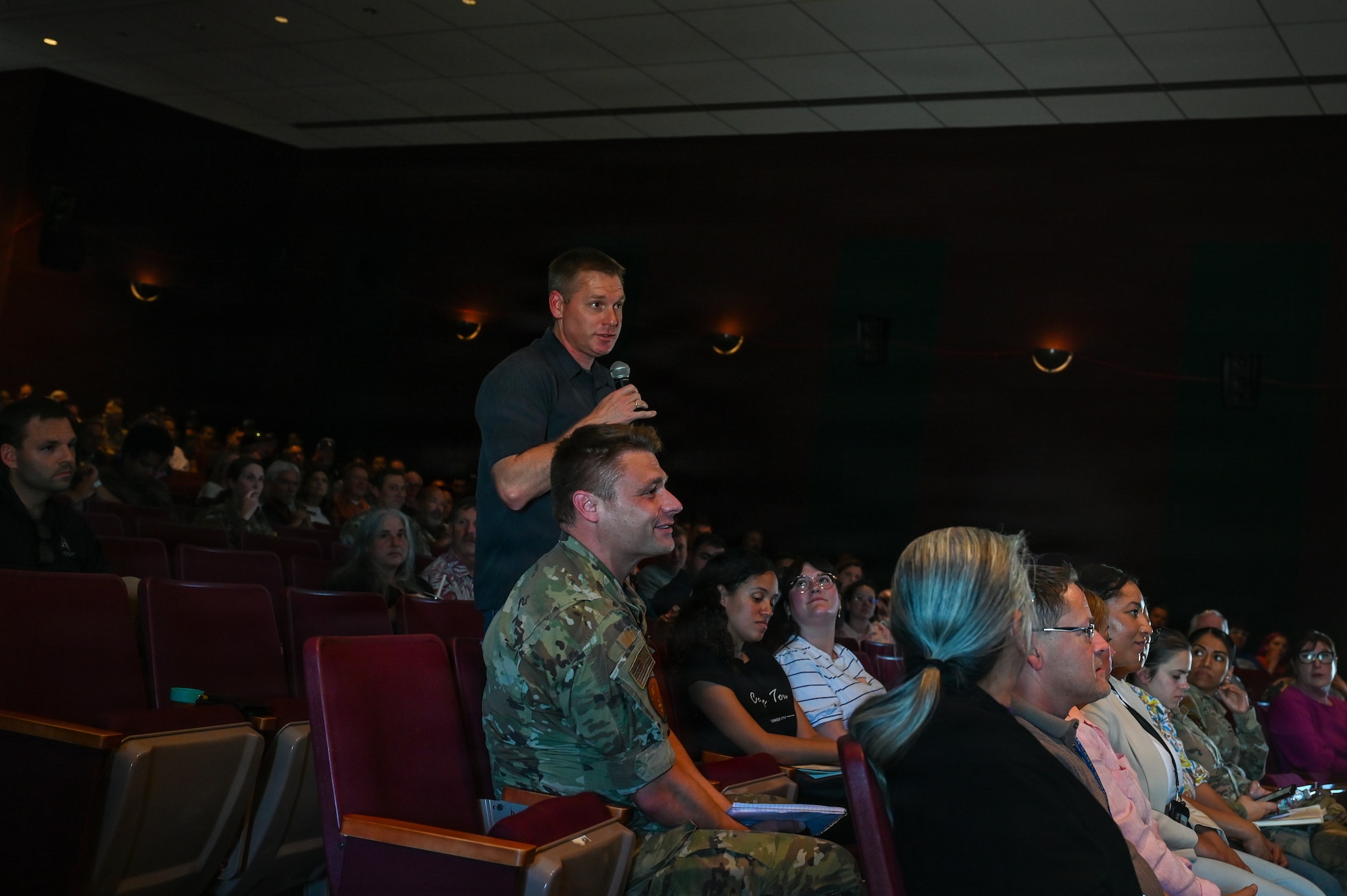 Nathan Foss stands and asks a question during an all-call.