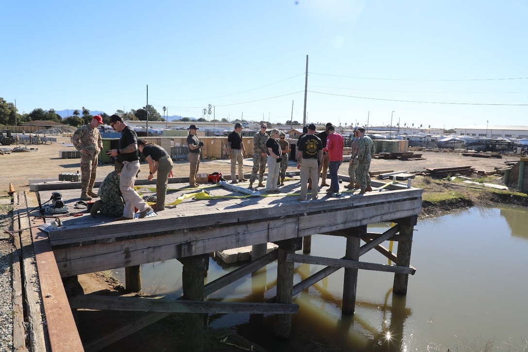 Participating units in the tri-service training environment included Naval Construction Groups One and Two, Army Dive units from the 130th, 20th and 555th Engineer Brigades and the U.S. Air Force RED HORSE Squadron. (U.S. Army Photo by Austin Hopkins, U.S. Army Engineer Research and Development Center)