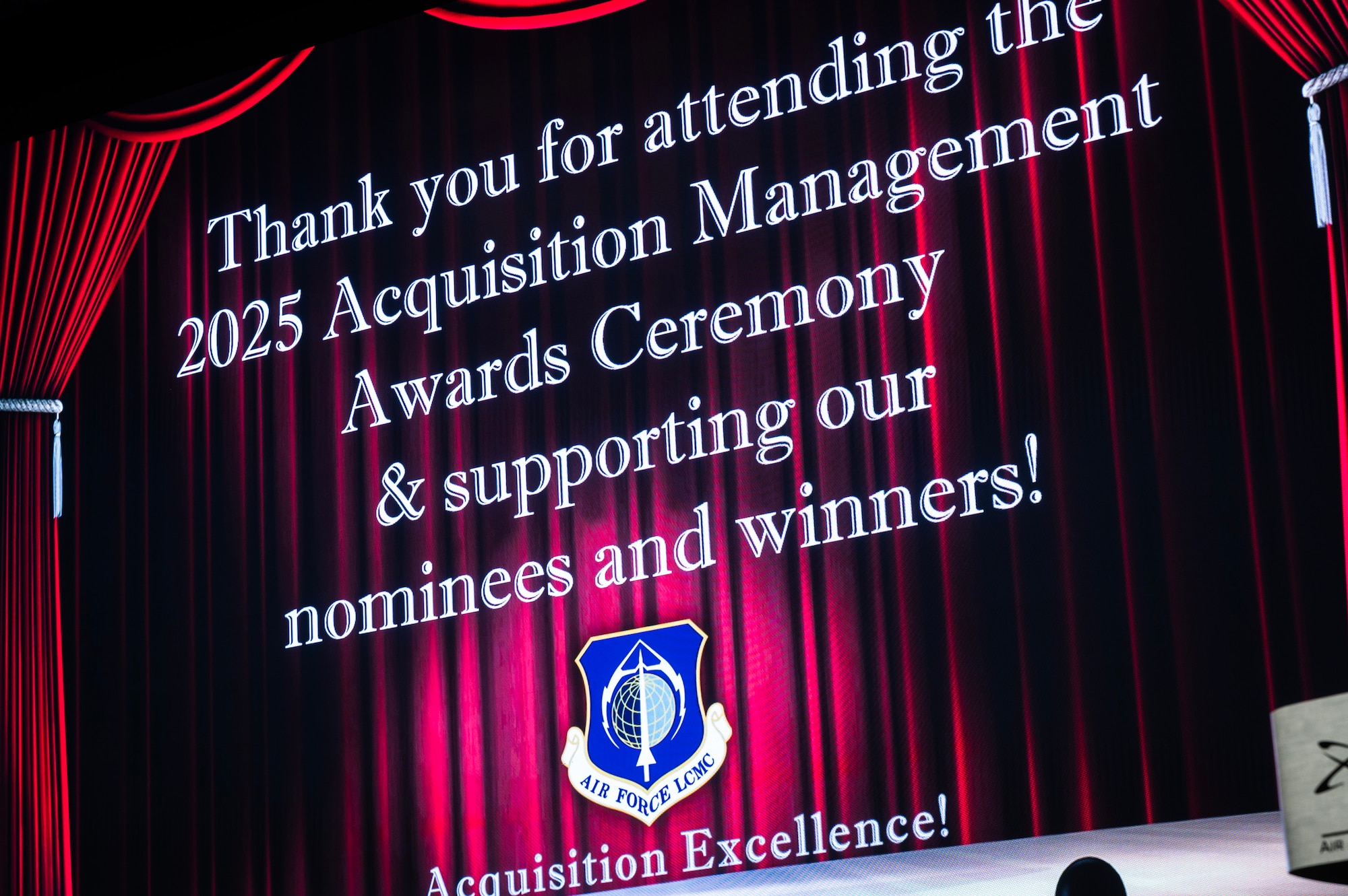 Screen says 2025 Acquisition Management Awards Ceremony