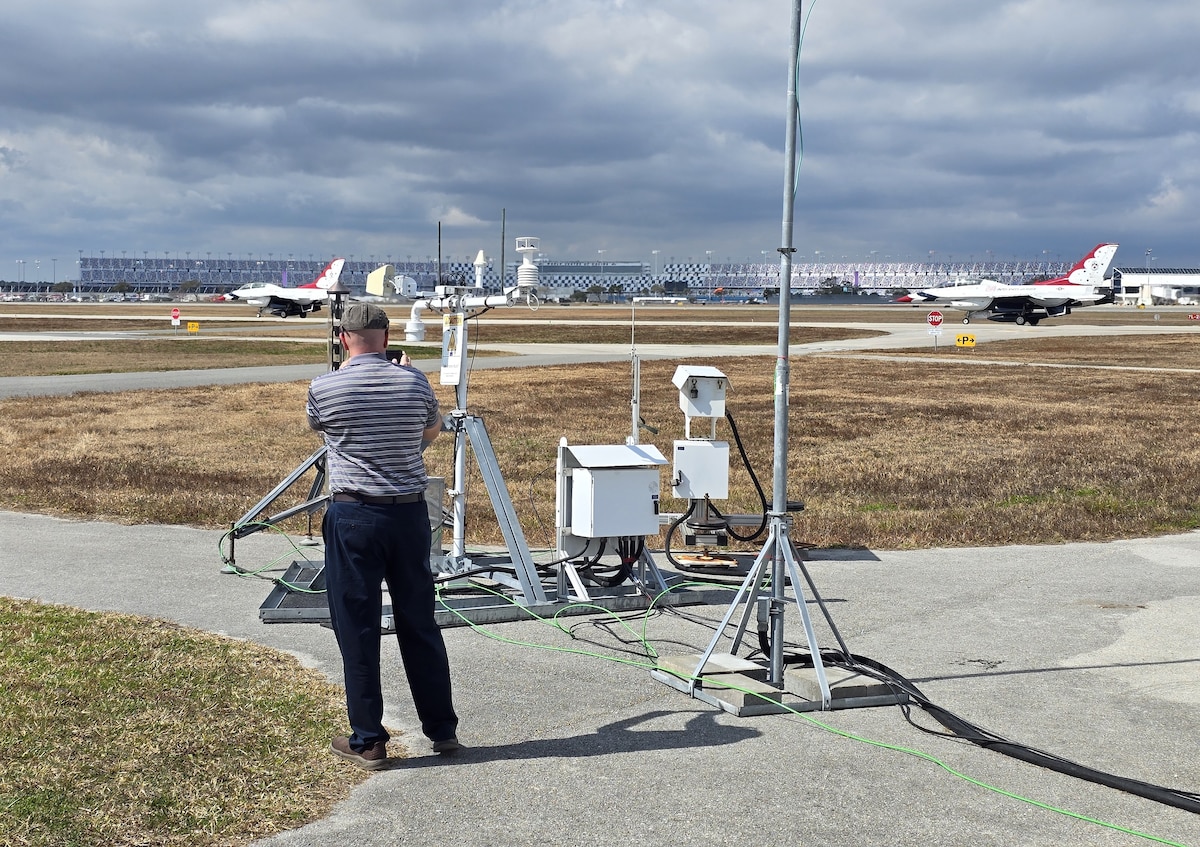 Michael Kaul, Deputy Program Manager for Systems Development Directorate at the Air Force Technical Applications Center, Patrick Space Force Base, Fla., records two U.S. Air Force Thunderbird F-16s as they taxi and prepare for takeoff at Daytona Beach International Airport Feb. 15, 2026.  The Thunderbirds were performing at the 2026 Daytona 500 NASCAR Cup Series, and Kaul and his team deployed the U.S. Prompt Diagnostics System’s new mobile capability to test it in a real-world, high visibility setting in support of National Technical Nuclear Forensics readiness.  (Courtesy photo)