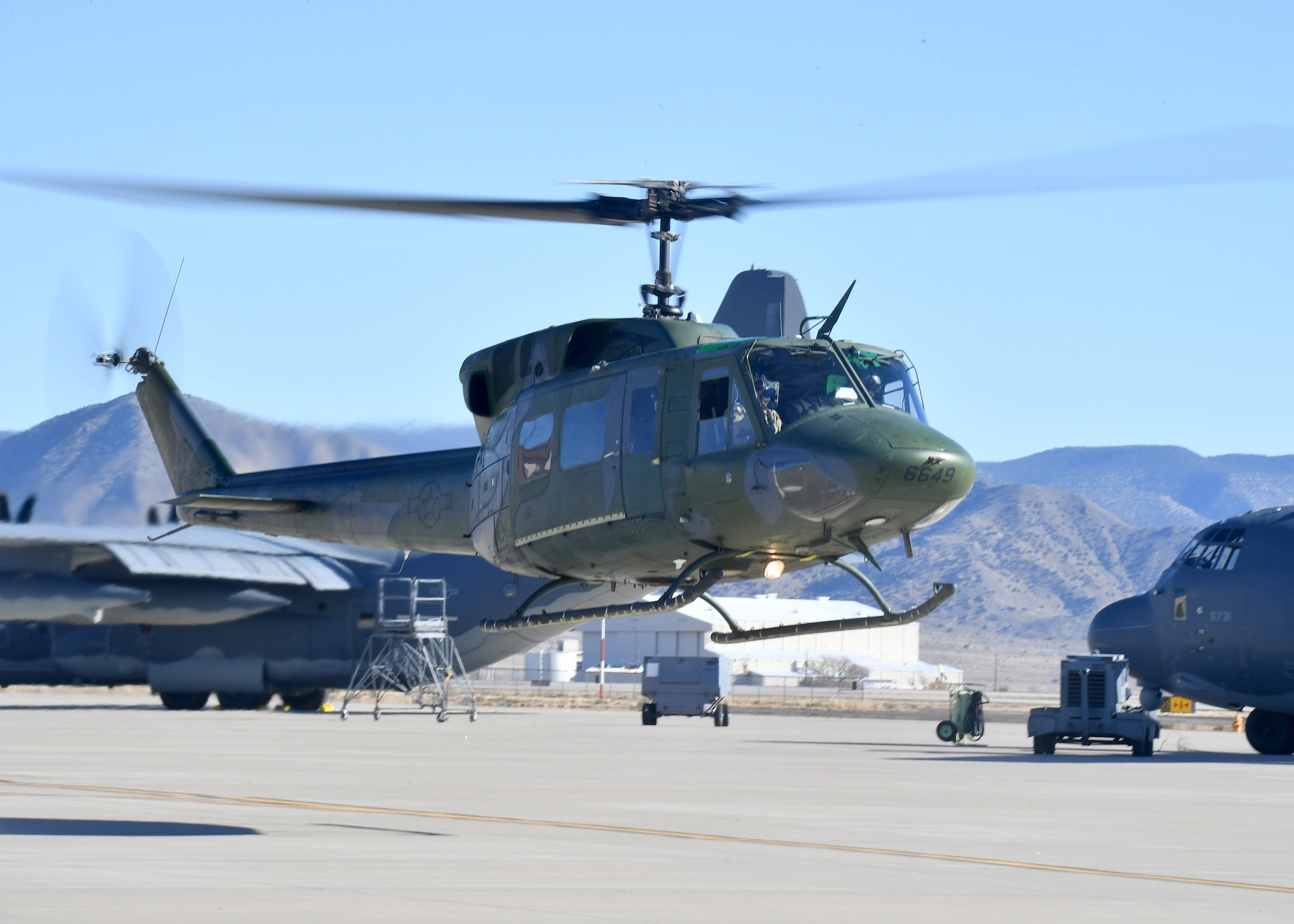 A UH‑1N “Huey” helicopter from the 58th Special Operations Wing’s Detachment 2 at Kirtland Air Force Base, N.M., lifts off during a training mission. The 58th SOW trains Air Force rotary‑wing pilots, including UH‑1N aircrews who support Air Force Global Strike Command’s security, nuclear enterprise, and strategic deterrence missions. Detachment 2 produces AFGSC‑ready pilots to strengthen the readiness, resilience, and credibility of the nation’s global strike capabilities. (Official U.S. Air Force photo by Todd R. Berenger)