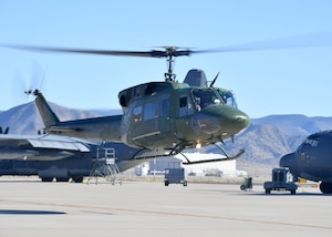 A UH‑1N “Huey” helicopter from the 58th Special Operations Wing’s Detachment 2 at Kirtland Air Force Base, N.M., lifts off during a training mission. The 58th SOW trains Air Force rotary‑wing pilots, including UH‑1N aircrews who support Air Force Global Strike Command’s security, nuclear enterprise, and strategic deterrence missions. Detachment 2 produces AFGSC‑ready pilots to strengthen the readiness, resilience, and credibility of the nation’s global strike capabilities. (Official U.S. Air Force photo by Todd R. Berenger)