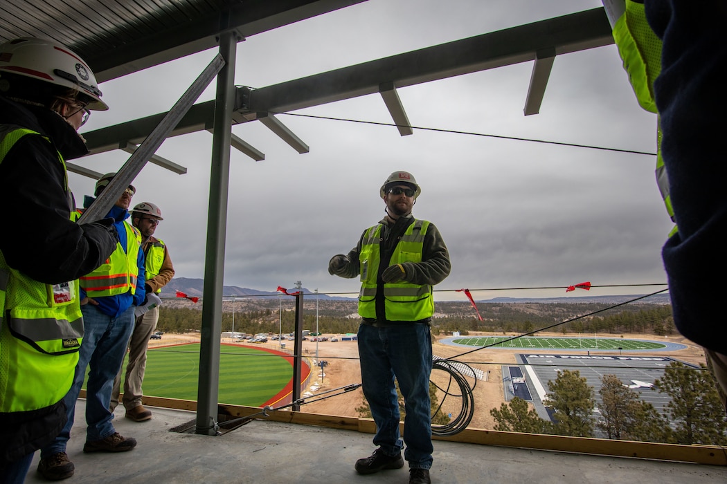 Cannen Welch, contracting officer representative, U.S. Army Corps of Engineers, Omaha District, guides a group of construction division supervisors on a tour of the U.S Air Force Academy Preparatory School dorm construction site in Colorado, Feb. 2, 2026. The tour was given as a part of a construction division all-supervisors meeting held at the academy. The dorm will replace three dorm buildings built in 1957, consolidating three squadrons of USAFA Preparatory School students under one roof. The new dorms are scheduled for completion in early 2027.