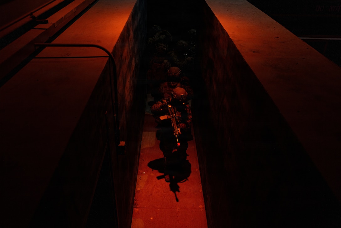 U.S. Marines Corps Pfc. Roman Juba, a rifleman with 12th Littoral Combat Team, 12th Marine Littoral Regiment, 3rd Marine Division, provides rear security during close quarter battle drills in a “shoot house” training facility at Camp Story, Republic of Korea, March 2, 2026. 12th LCT Marines trained in specialized combat marksmanship tactics, including room clearing, navigating stairways and hallways, and overcoming obstacles in confined environments. The training simulated a fast-paced, high-stress scenario to enhance situational awareness. Juba is a native of Missouri. (U.S. Marine Corps photo by Lance Cpl. Robert Blanks)