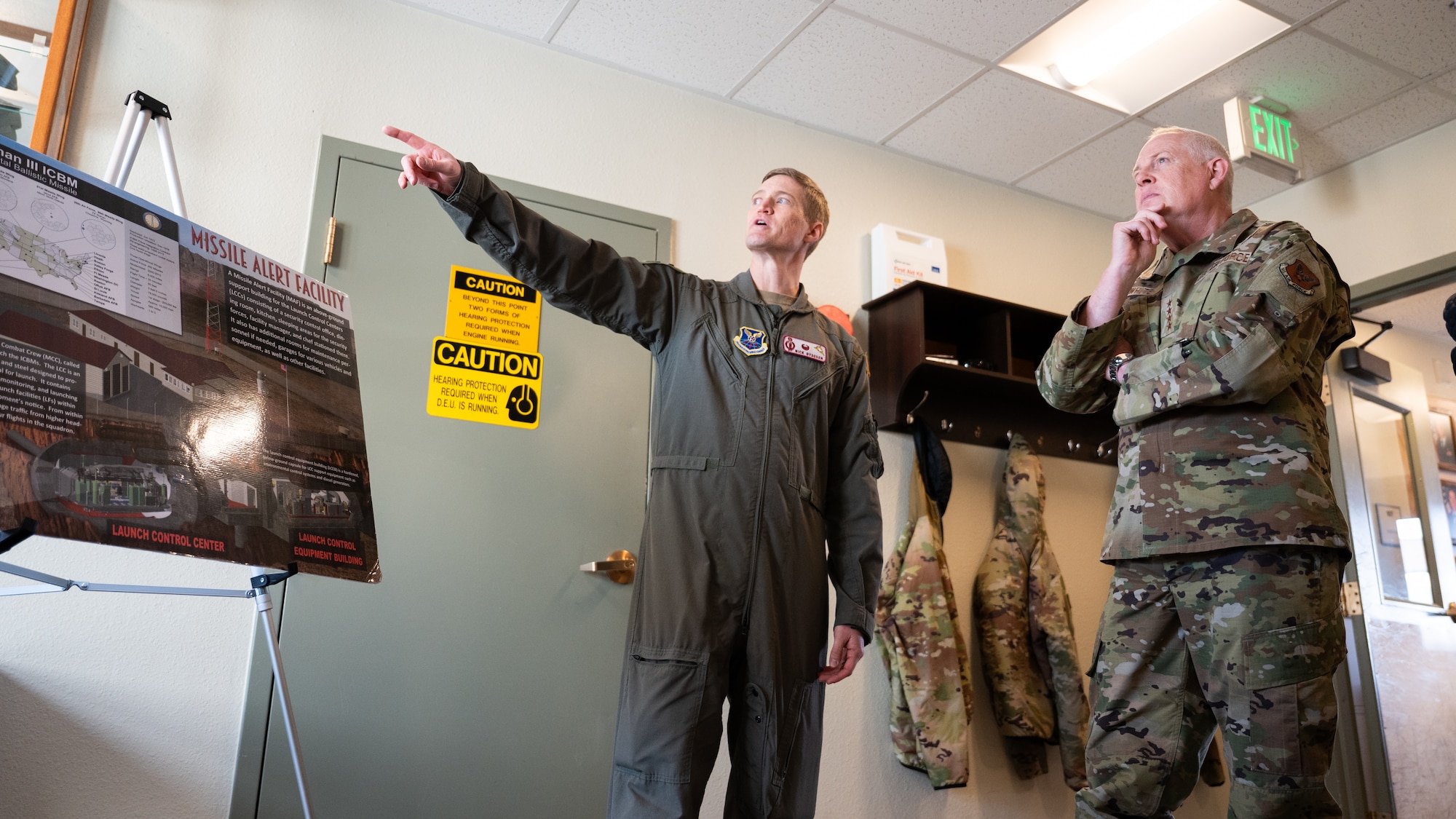 U.S. Air Force Gen. Dale R. White is briefed by U.S. Air Force Lt. Col Nicholas Gydesen.