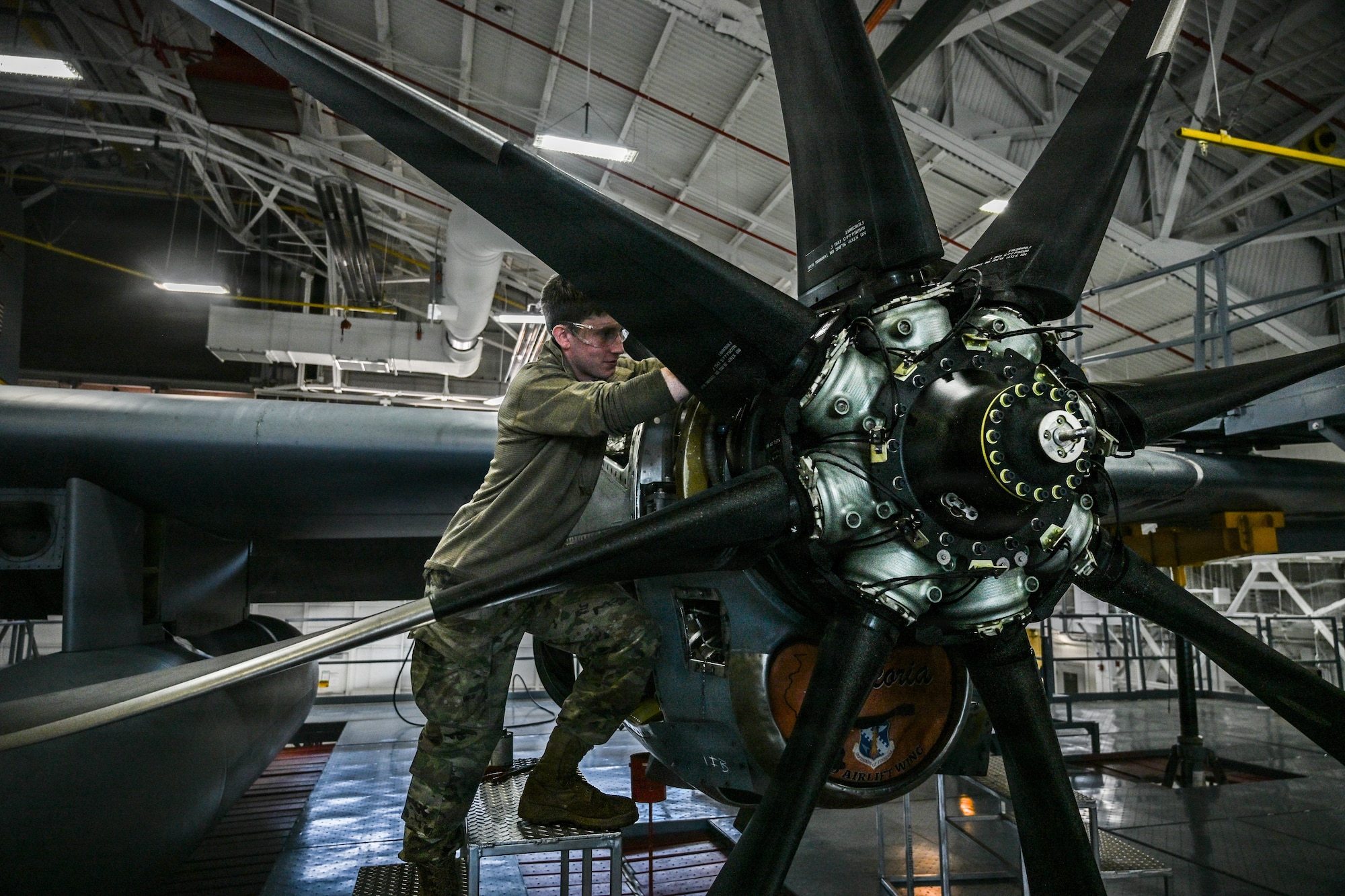 U.S. Staff Sgt. David Hatch, a propulsion technician in the 103d Maintenance Squadron Propulsion Shop, works on an NP2000 propellor for a C-130 Hercules in East Granby, Connecticut, on Oct.3, 2025. The new eight-bladed propellers enable heavier take-off weights, provide more thrust, and reduce overall propellor maintenance time. (U.S. Air National Guard photo by Captain Jen Kaprielian)