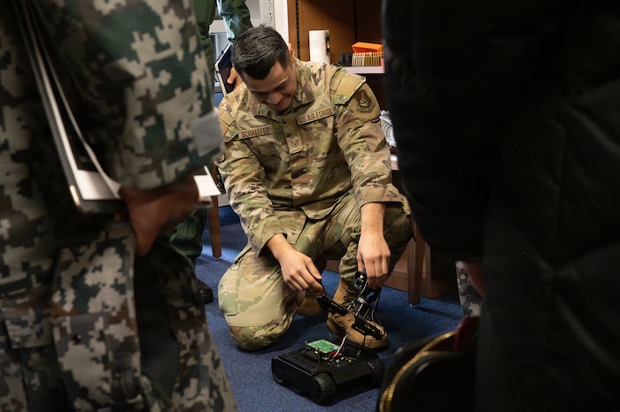 U.S. Air Force Tech Sgt. Andrew Schaeffer, 35th Fighter Wing Staff Agency Innovation Cell director, showcases examples of his section’s innovation products to Japan Air Self-Defense Force leaders during a Chief of Staff of the Air Force Strategic Studies Group tour at Misawa Air Base