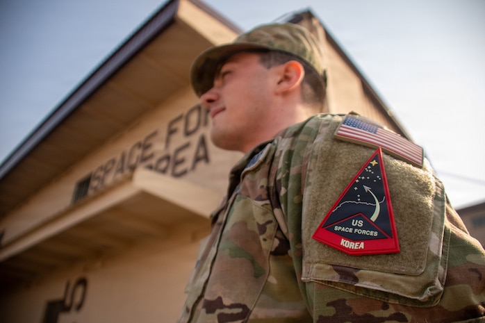 U.S. Space Force Spc. 4 Brandon Spitz, attached to U.S. Space Forces – Korea during exercise Freedom Shield 26, wears the unit’s patch at Osan Air Base, Republic of Korea, March 17, 202