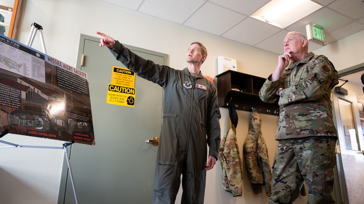 U.S. Air Force Gen. Dale R. White is briefed by U.S. Air Force Lt. Col Nicholas Gydesen.