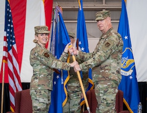 U.S. Air Force Lt. Gen. Laura Lenderman, Pacific Air Forces deputy commander, presents the guidon to Lt. Gen. Joel Carey, 5th Air Force incoming commander, during the 5AF change of command ceremony at Yokota Air Base, Japan, March 24, 2026. This momentous change to the 5AF structure demonstrates the Department’s commitment to Japan and maintaining the security and stability in DoD’s priority theater. (U.S. Air Force photo by Airman 1st Class Kayla Karelas)