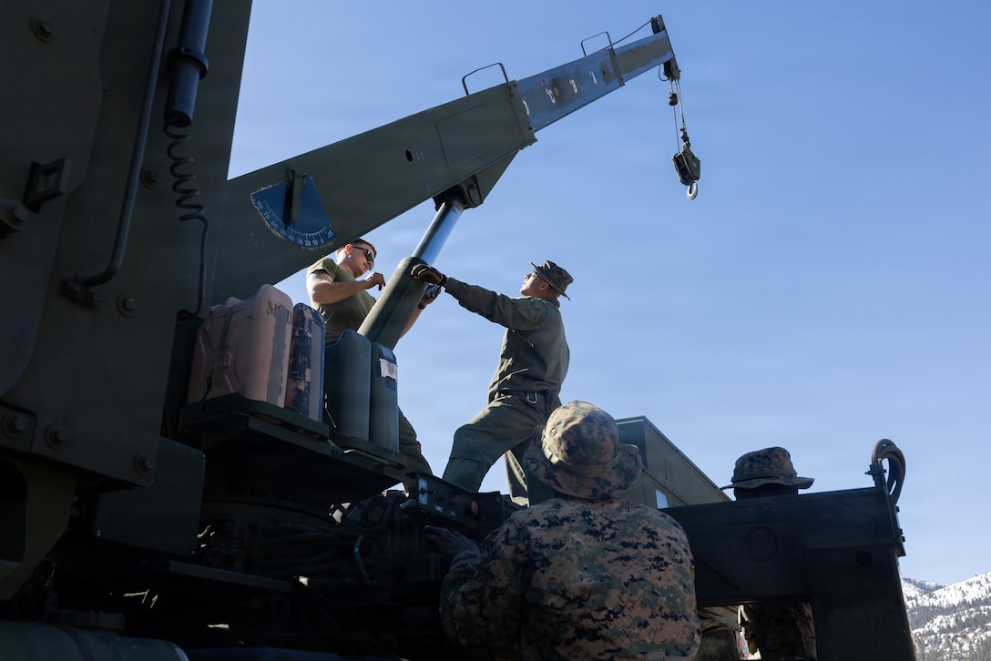 U.S. Marines with 2nd Combat Engineer Battalion, 2nd Marine Division operate and clean the boom on a 7-ton wrecker truck during Mountain Training Exercise 2-26 at Marine Corps Mountain Warfare Training Center, Bridgeport, California, Feb. 28, 2026. MTX-26 is designed to prepare units to strengthen expeditionary warfare tactics and build confidence in their ability to operate in a cold-weather, high-altitude, mountainous environment. (U.S. Marine Corps photo by Cpl. Jesse Davis)
