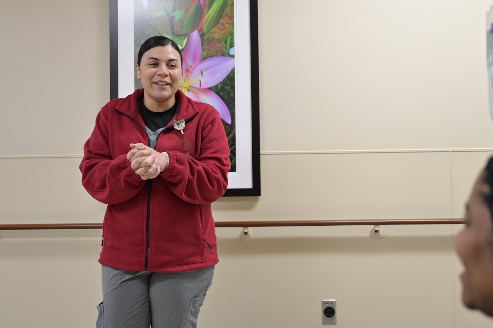 Capt. Aisha Perez speaks with a patient prior to a nutrition consultation at Carl R. Darnall Army Medical Center. The temporary walk-in clinic provided nutrition support for expecting and postpartum parents.