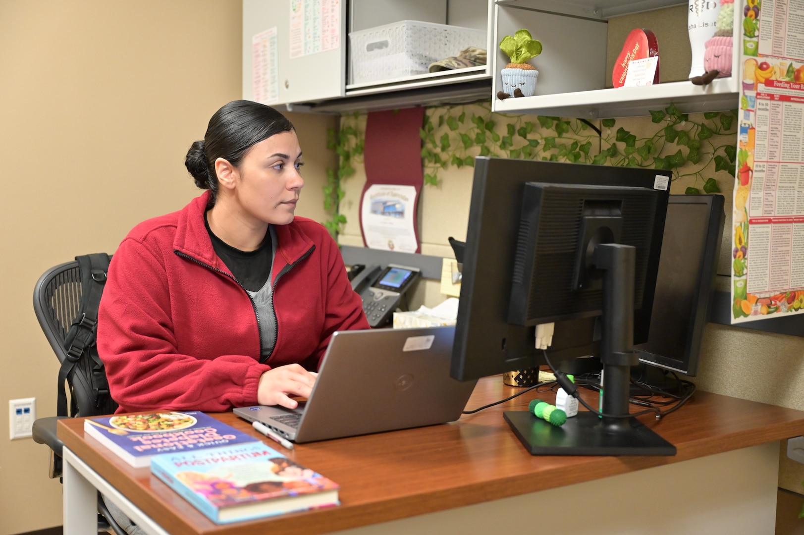 Capt. Aisha Perez, director of prenatal and gestational nutrition at the Women’s Health Clinic, reviews patient information prior to a consultation at Carl R. Darnall Army Medical Center. Perez recently supported expecting and postpartum parents through a temporary walk-in nutrition clinic.