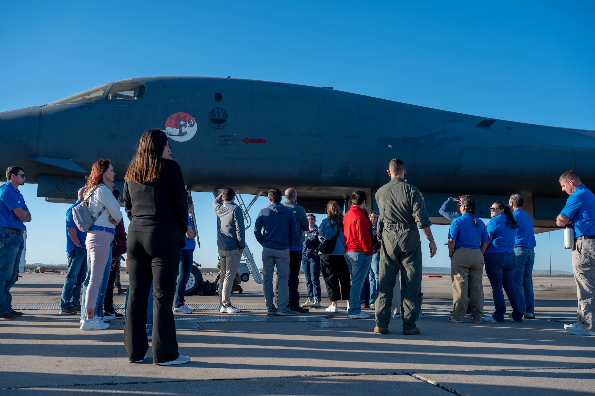Members of the Leadership Abilene Class of 2026 observe a B-1B Lancer during the annual ‘Dyess Day’ tour at Dyess Air Force Base, Texas, March 19, 2026. The visit gave participants an up-close view of the aircraft, providing insight into its critical role in global operations. (U.S. Air Force photo by Airman 1st Class William Neal)