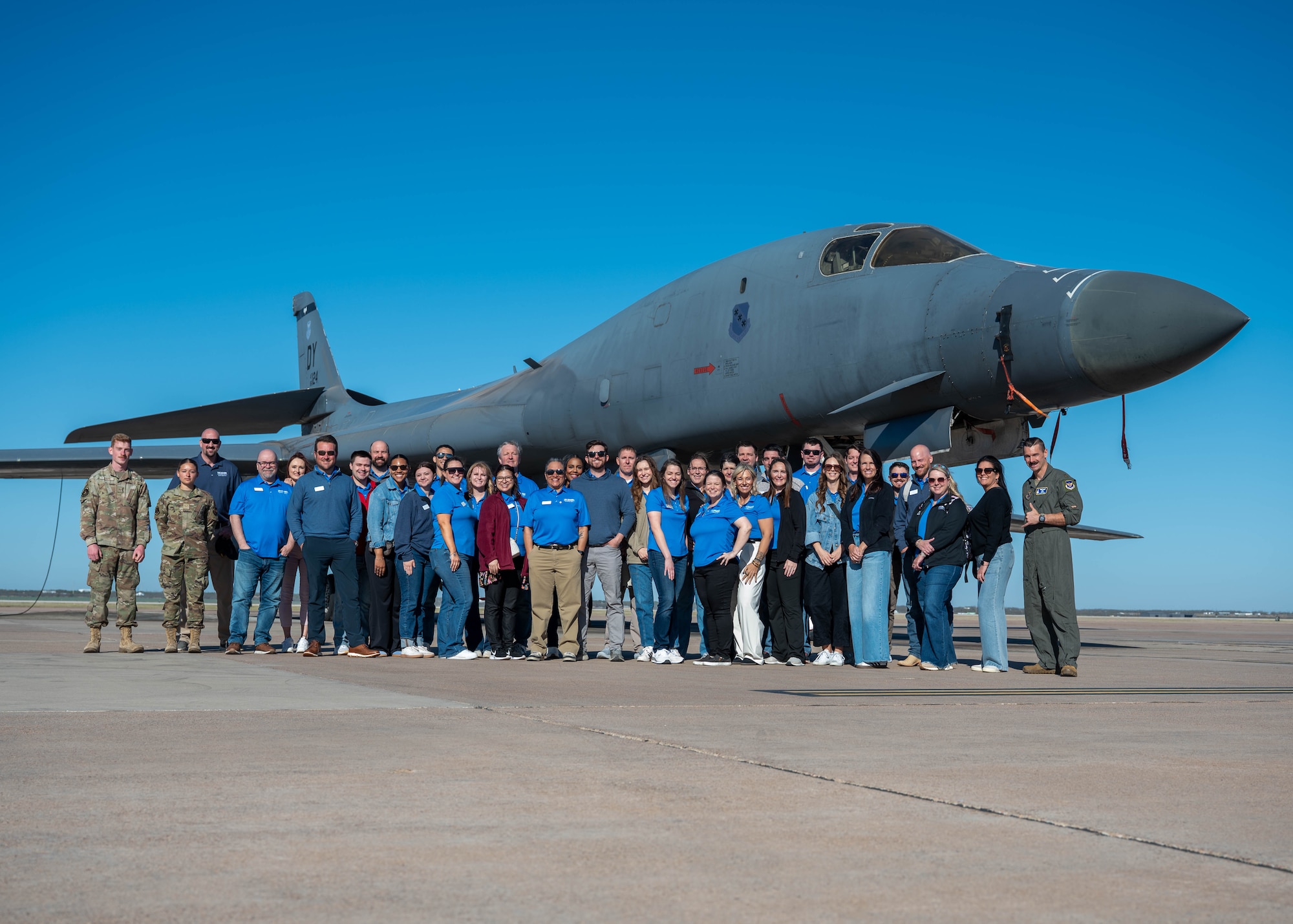 Members of the Leadership Abilene Class of 2026 pose for a group photo in front of a B-1B Lancer at Dyess Air Force Base, Texas, March 19, 2026. The group visited the installation for the annual ‘Dyess Day,’ an event designed to inform influential local leaders about the diverse missions at Dyess. (U.S. Air Force photo by Airman 1st Class William Neal)