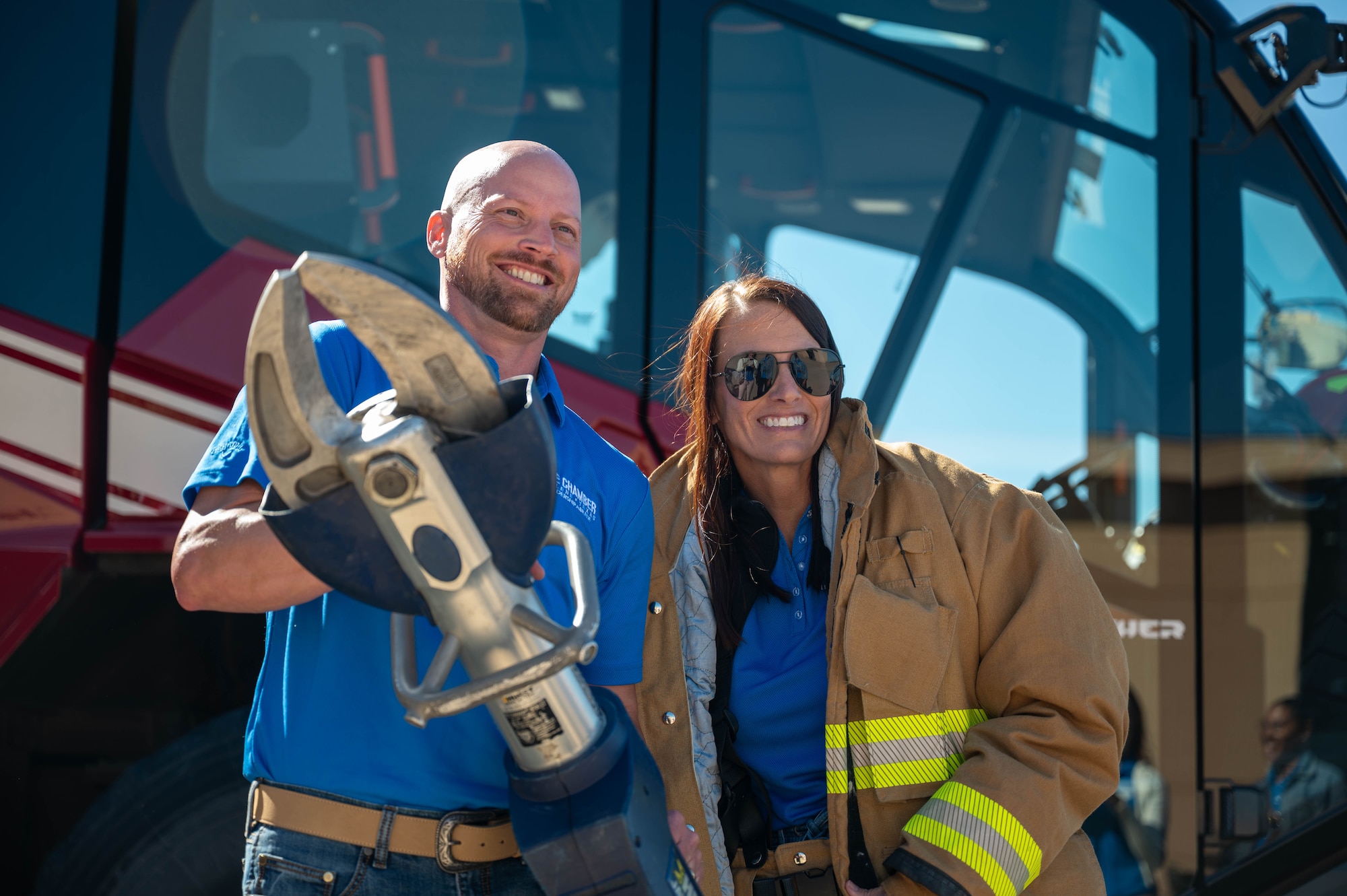 Members of the Leadership Abilene Class of 2026 pose for a photo with 7th Civil Engineers Squadron firefighting equipment at Dyess Air Force Base, Texas, March 19, 2026.  The demonstration provided insight into the tools, techniques and procedures that are used to respond to emergencies. (U.S. Air Force photo by Airman 1st Class William Neal)