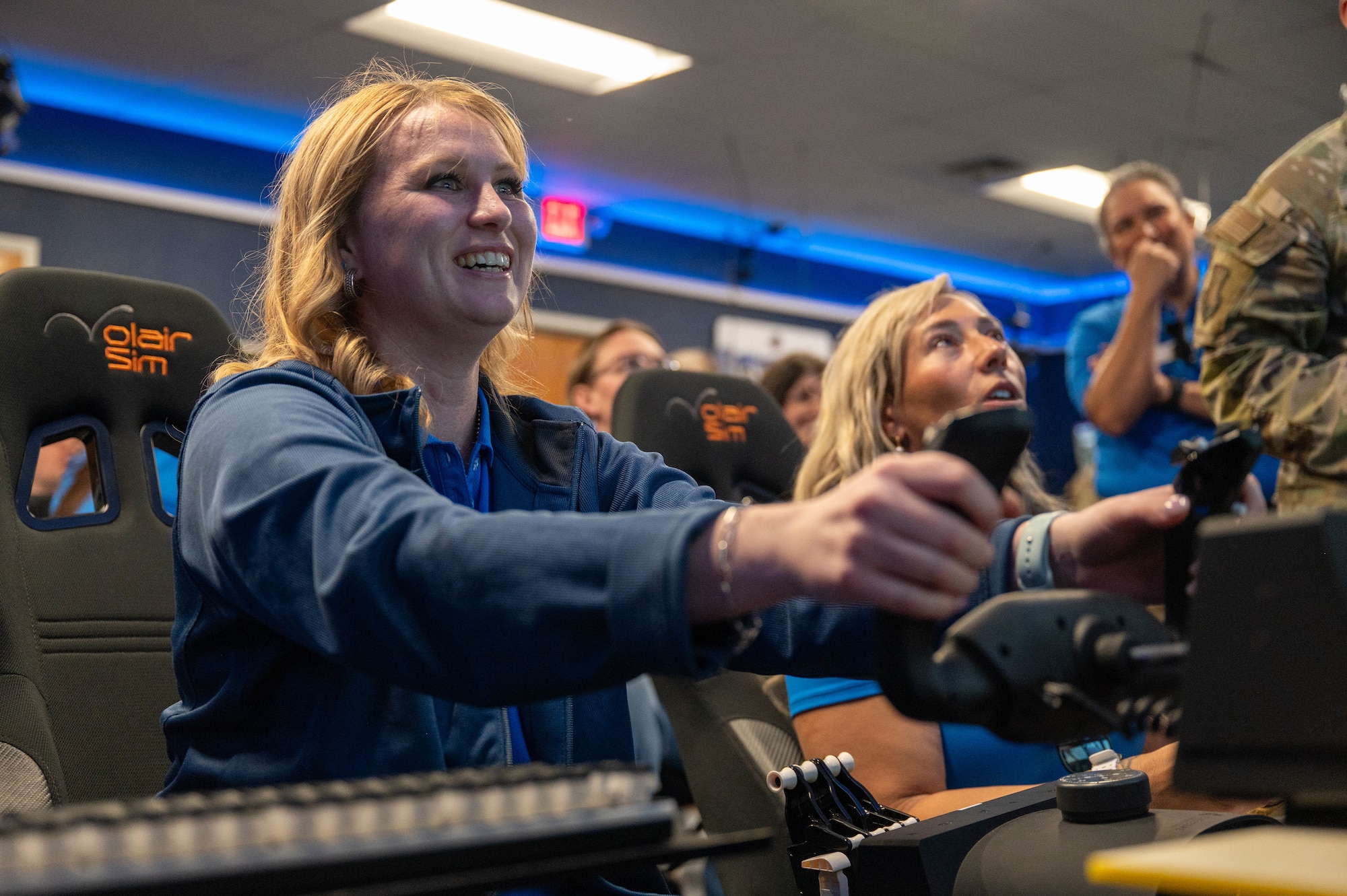 A Leadership Abilene Class of 2026 member operates a C-130J Super Hercules flight simulator during a visit to Dyess Air Force Base, Texas, March 19, 2026. The experience provided insight into aircrew training and the capabilities of the C-130 during a simulated flight. (U.S. Air Force photo by Airman 1st Class William Neal)