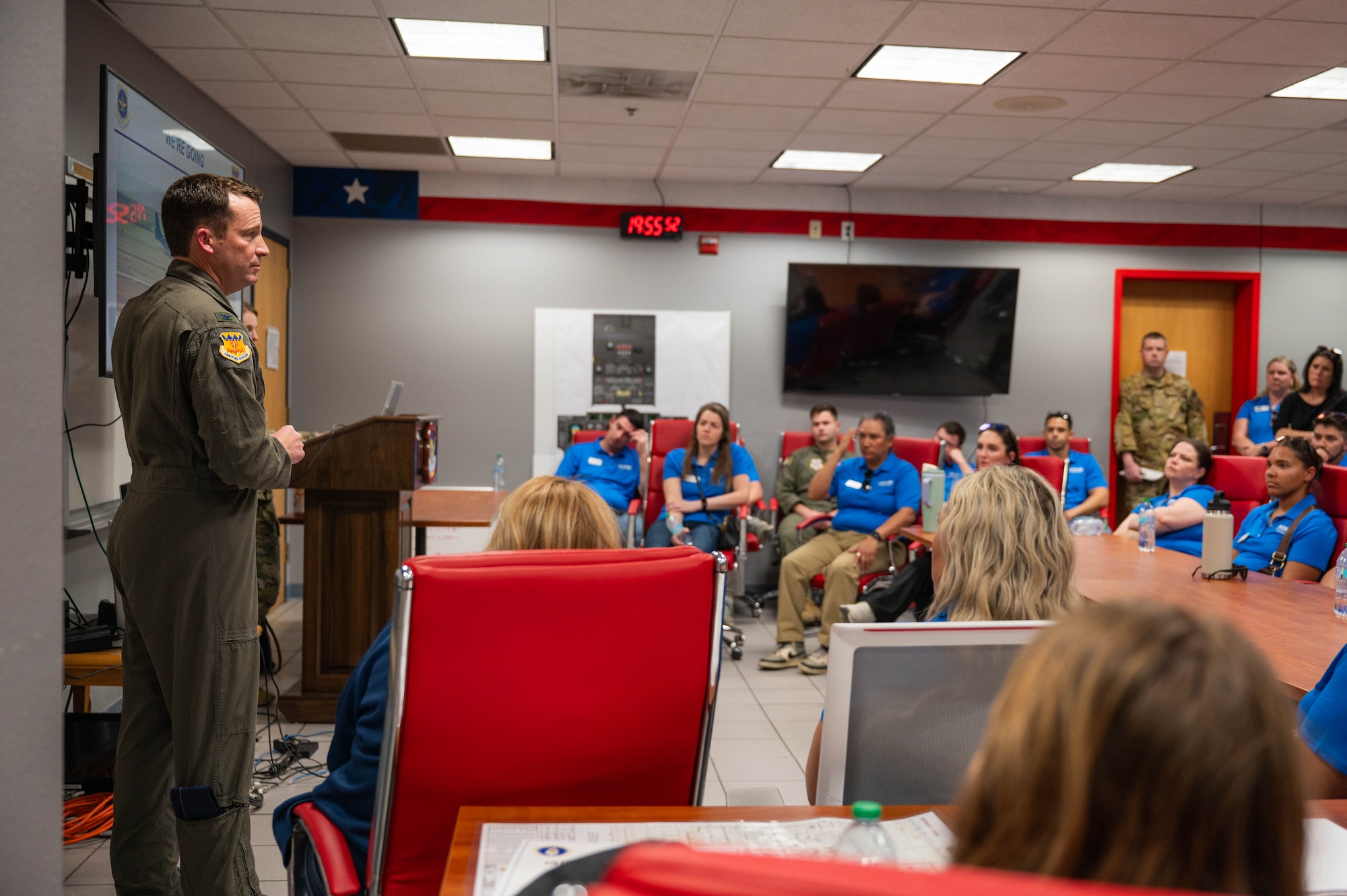 U.S. Air Force Col. Justin Diehl, 317th Airlift Wing commander, delivers a mission brief to the Leadership Abilene Class of 2026 at Dyess Air Force Base, Texas, March 19, 2026. The brief provided community leaders a better understanding of the strategic role that the 317th AW plays in global airlift operations. (U.S. Air Force photo by Airman 1st Class William Neal)